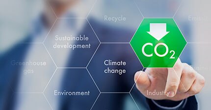 man standing in front of CO2 graphic