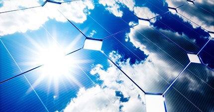 solar panels with sunny sky reflecting